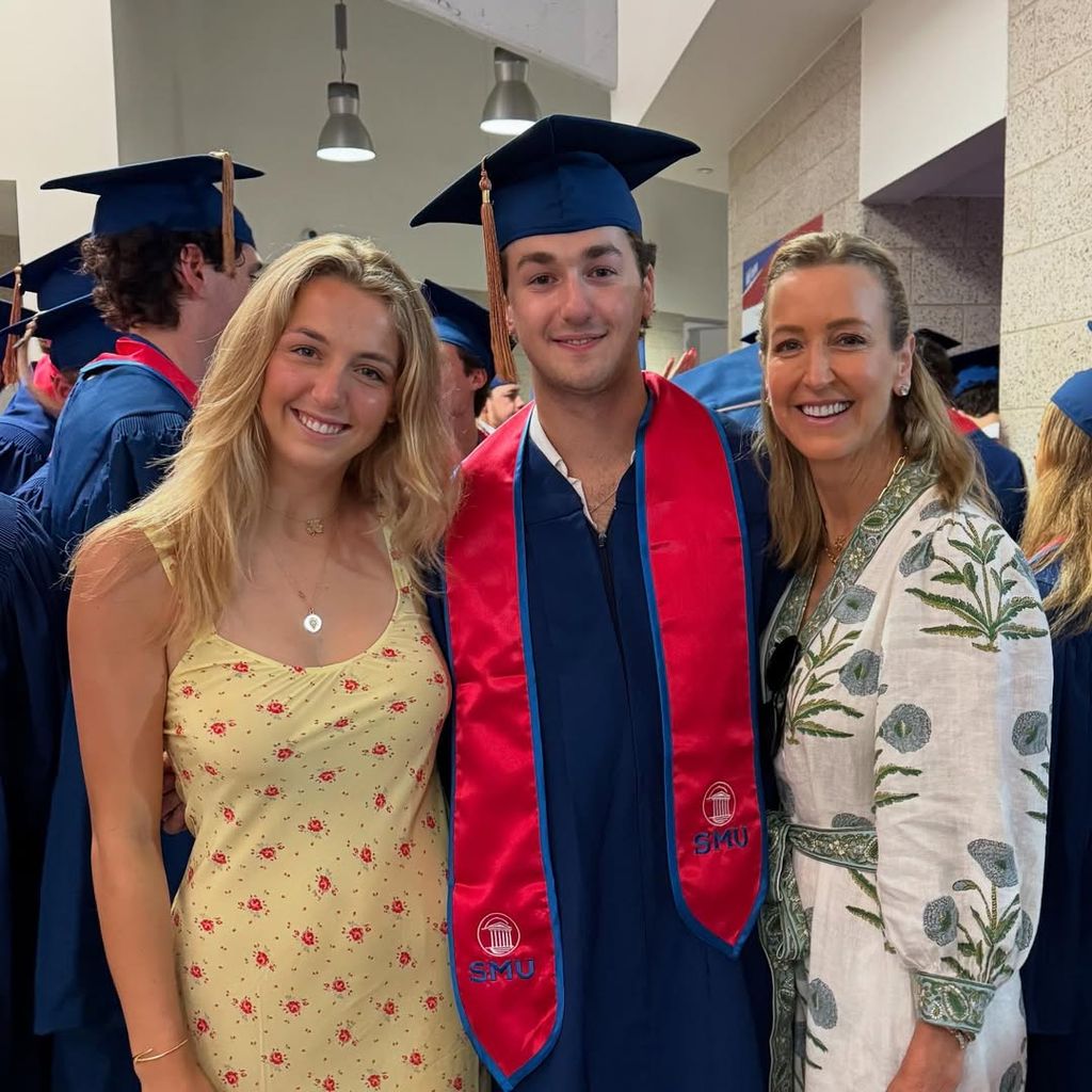 Lara and her kids smiling at graduation