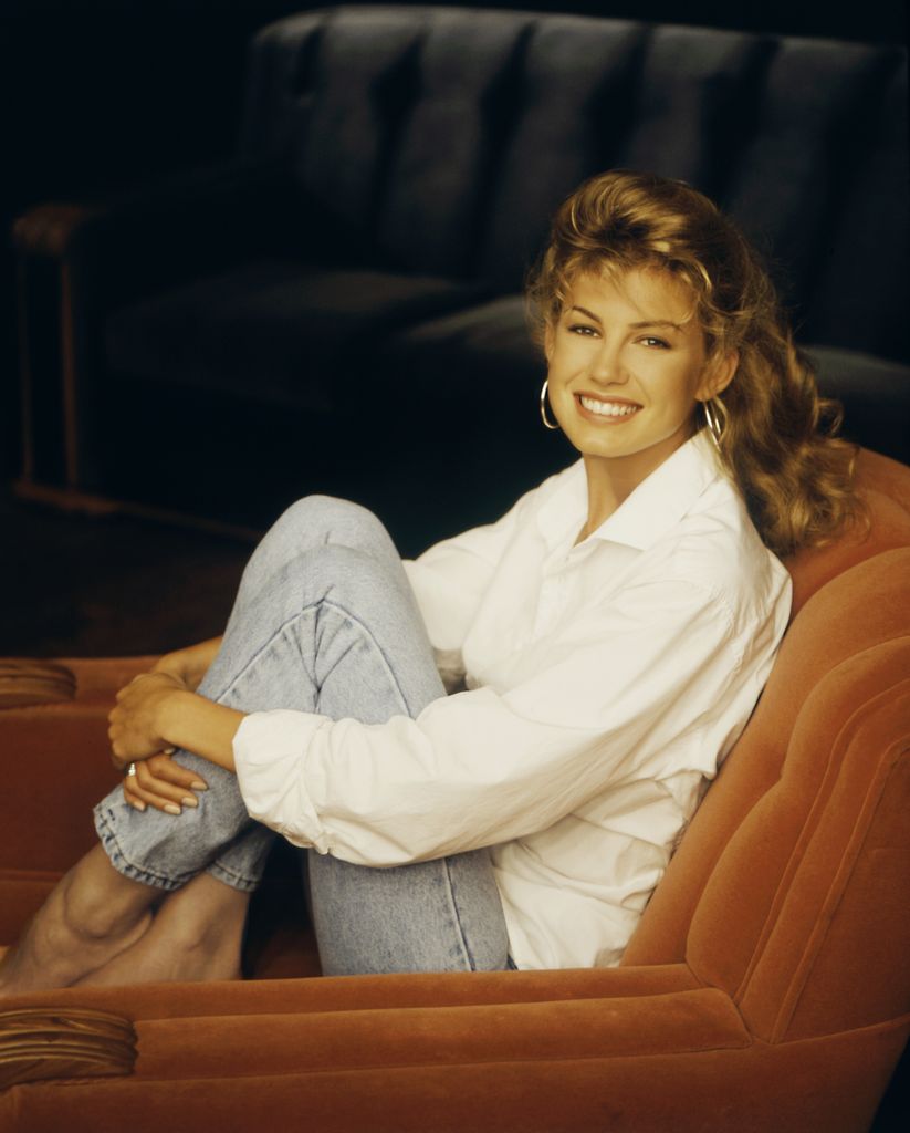 faith hill sitting in a chair