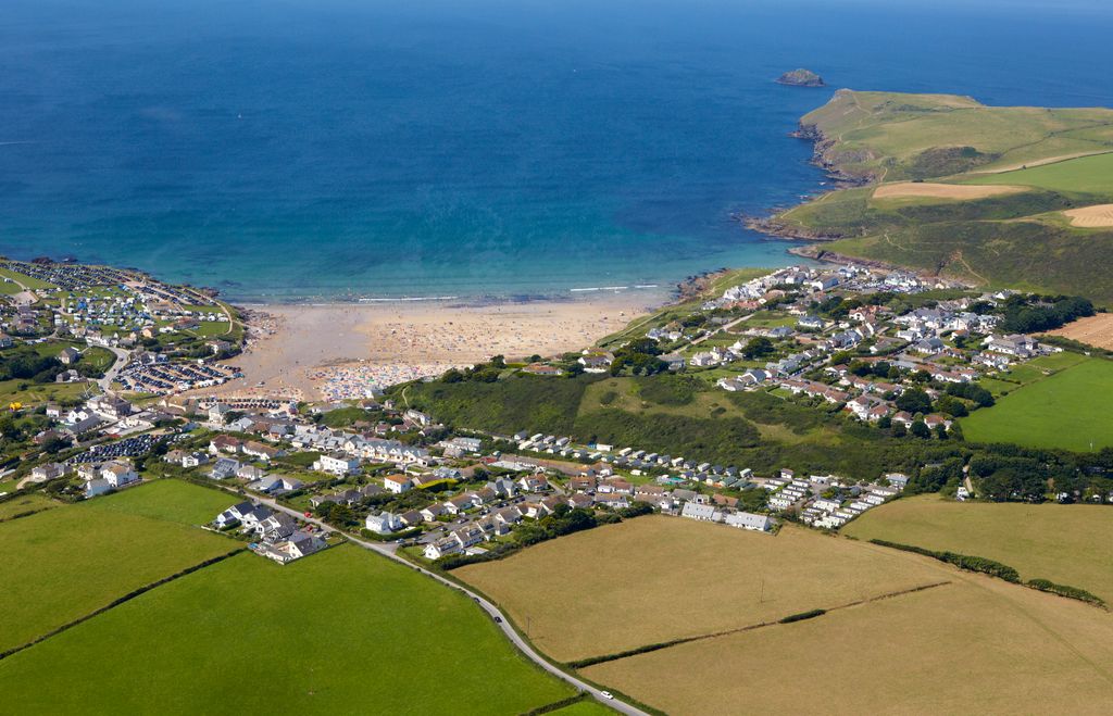 Aerial view of the Cornish coastal resort of Polzeath and Padstow bay