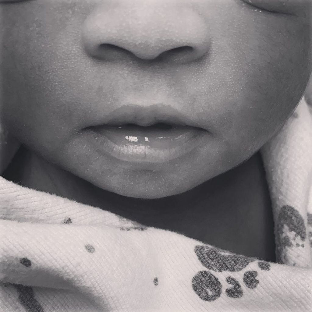 The first picture of Usher's baby Sire