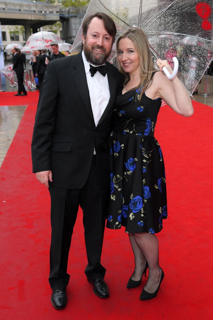 couple posing on red carpet