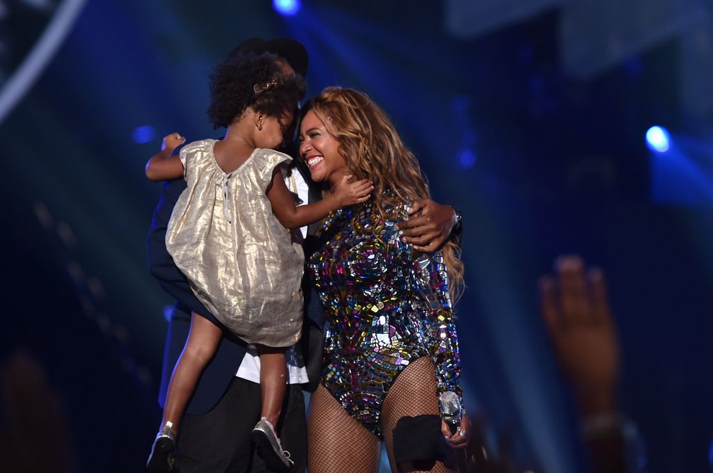 INGLEWOOD, CA - AUGUST 24:  (L-R) Blue Ivy Carter, recording artists Jay Z and Beyonce speak onstage during the 2014 MTV Video Music Awards at The Forum on August 24, 2014 in Inglewood, California. (Photo by MTV/MTV1415/Getty Images for MTV)