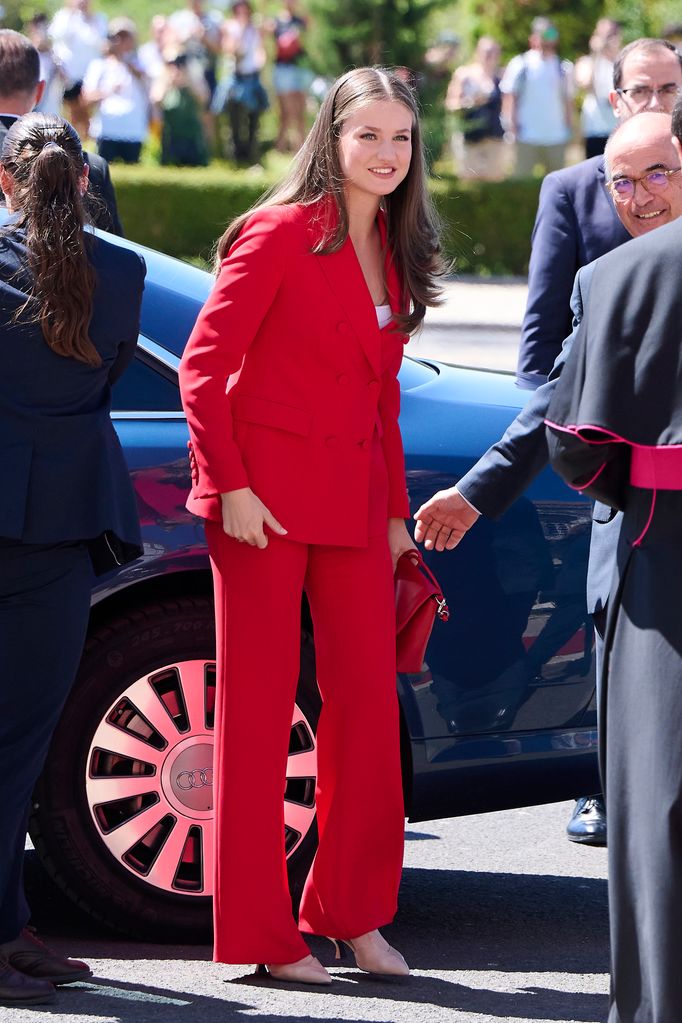 Princess Leonor exiting car in red suit