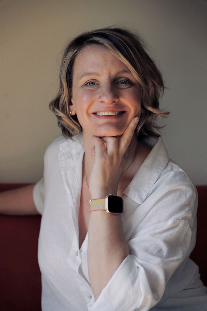 woman smiling in a white shirt 