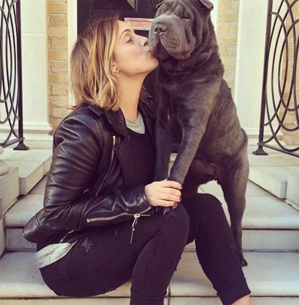 Louise Redknapp in black outfit with dog