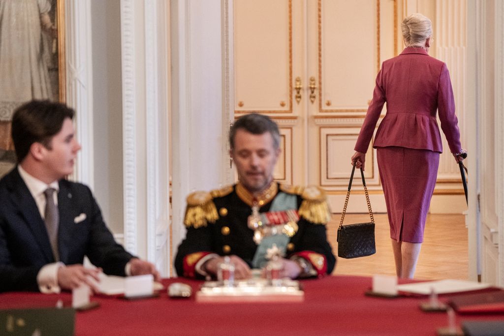 Queen Margrethe exits after abdication as King Frederik heads up the table