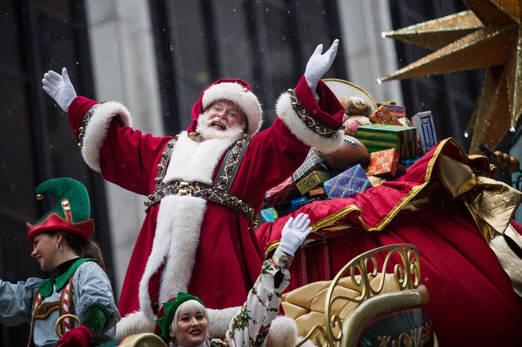 Santa Claus waves to the crowd during the Macy's Thanksgiving Day Parade on November 27, 2014 in New York City. The annual tradition marks the start of the holiday season.