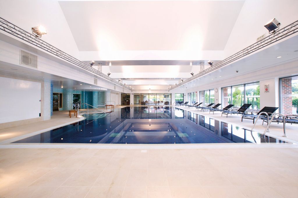 Indoor swimming pool with loungers