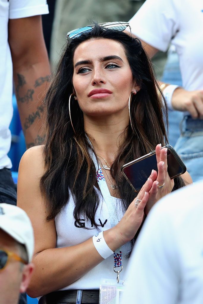 Kyle Walker's girlfriend clapping and wearing sunglasses