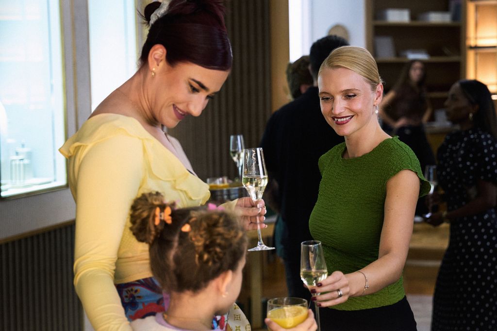 two women at party with young girl