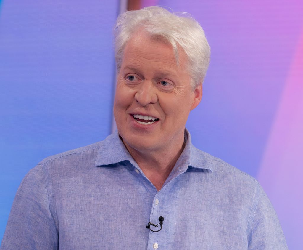 Charles Spencer in a blue shirt