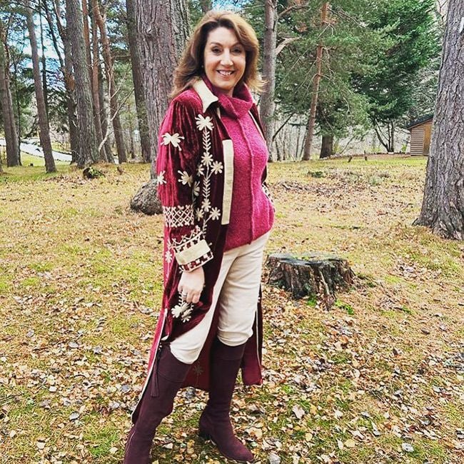 loose women star jane mcdonald wearing festive jacket and knee high boots