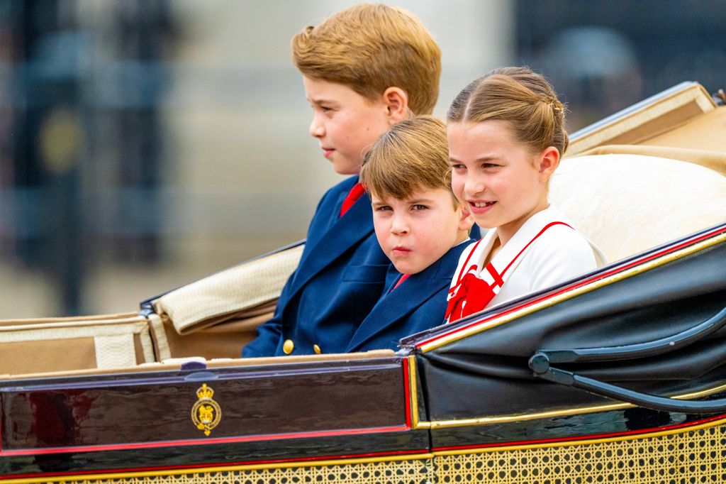 three children in carriage 