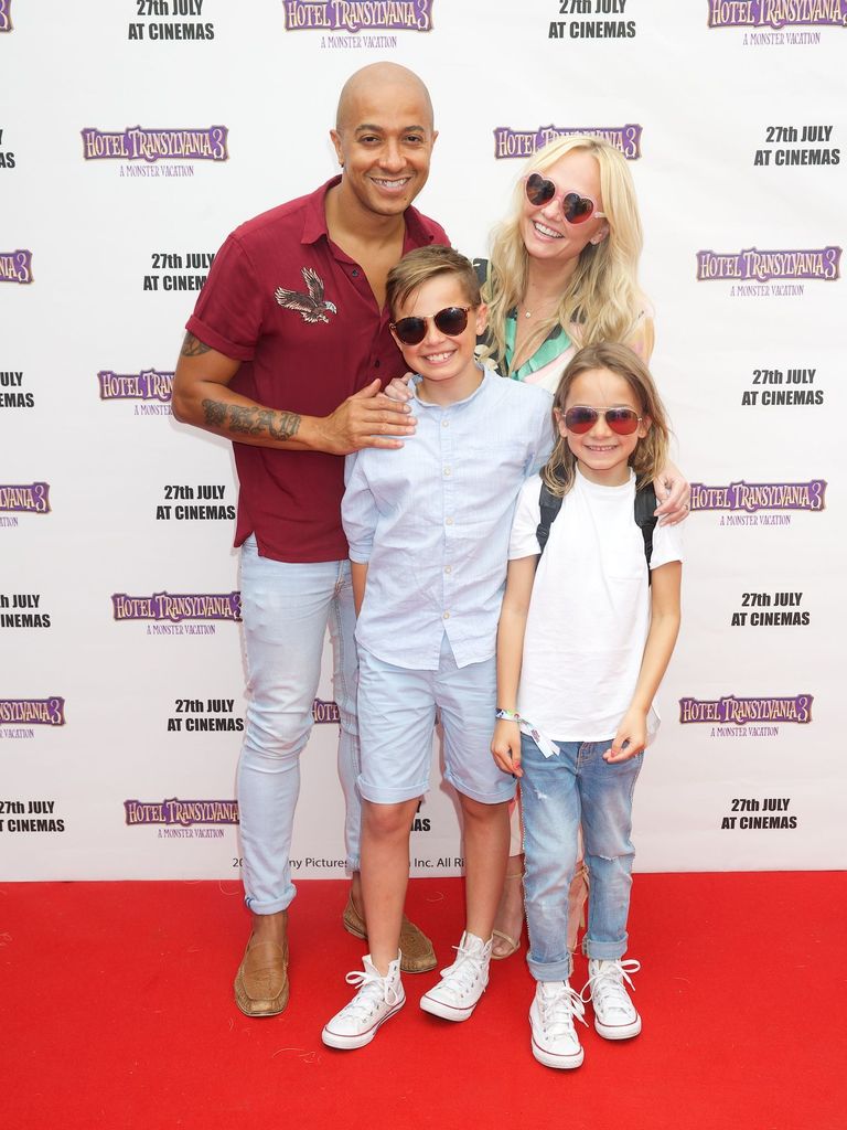 Emma Bunton wearing sunglasses on the red carpet with her kids