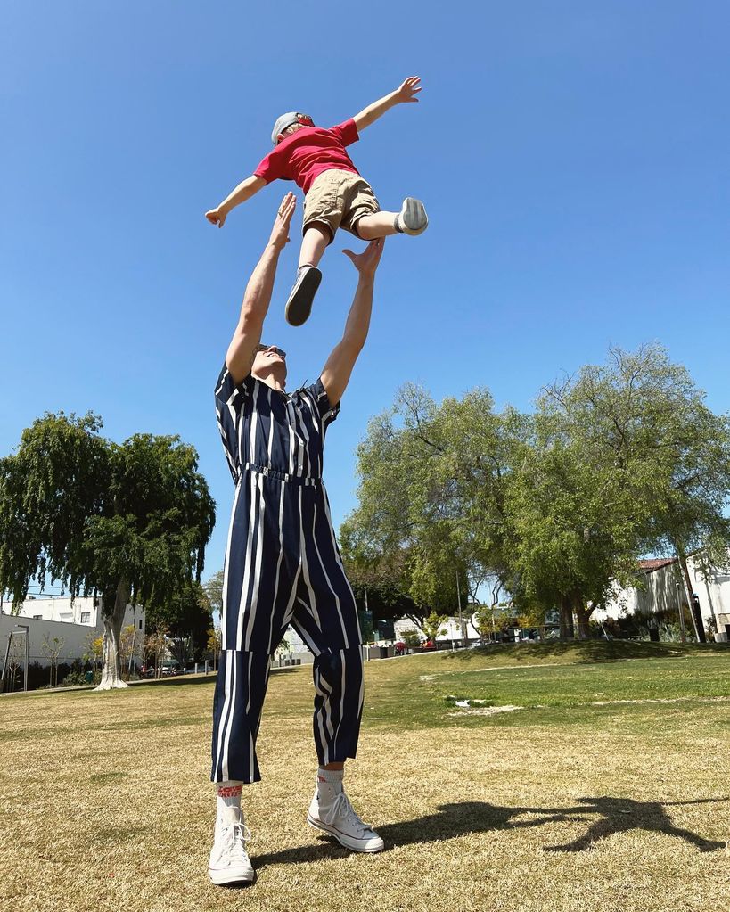 father throwing child into air