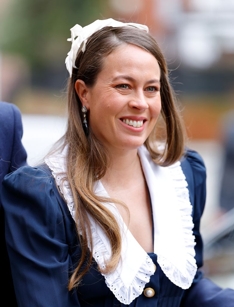 Princess Nina in a blue outfit with white frills