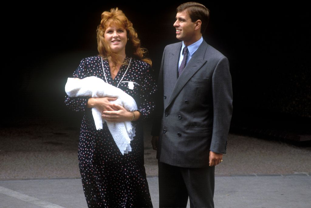 Sarah, Duchess of York holding baby beside prince andrew