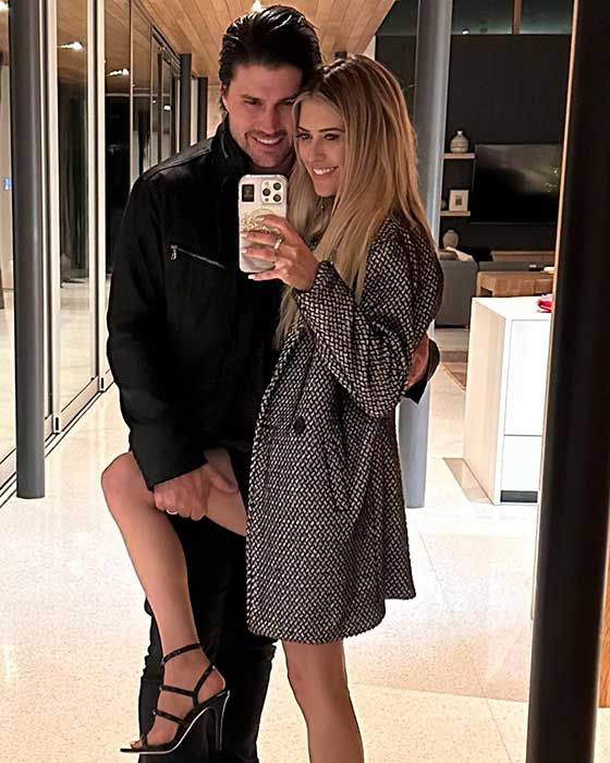 Christina and her husband Josh Hall posing for a mirror selfie