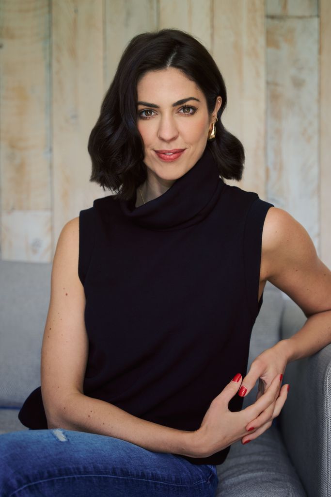 woman in a black top with dark hair