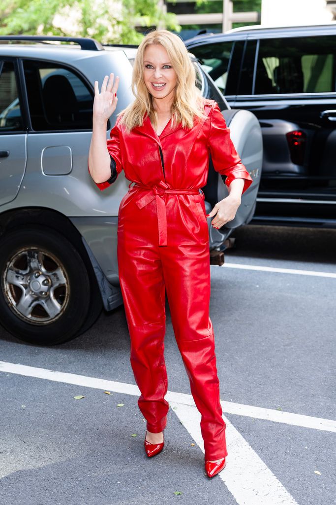 Kylie wearing a red leather jumpsuit 