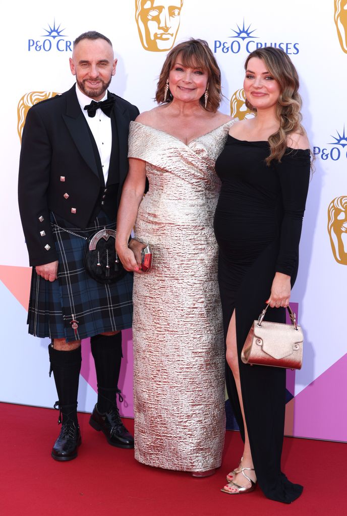 trio on red carpet at BAFTA Television Awards