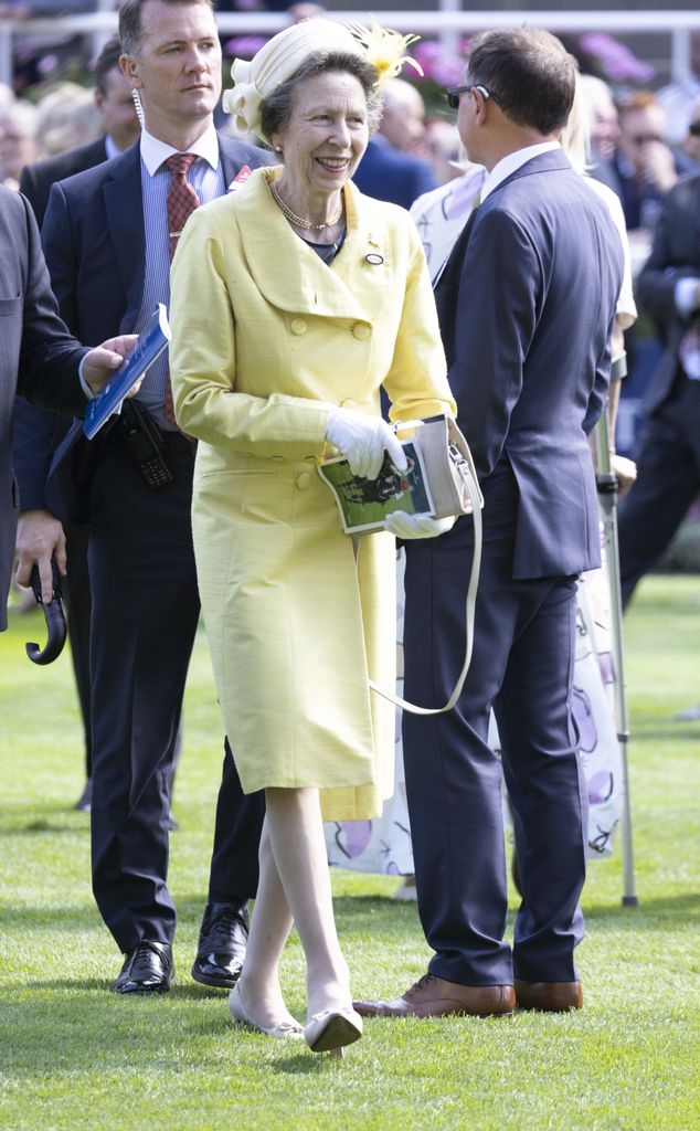Princess Anne accessorised with a cream clutch bag