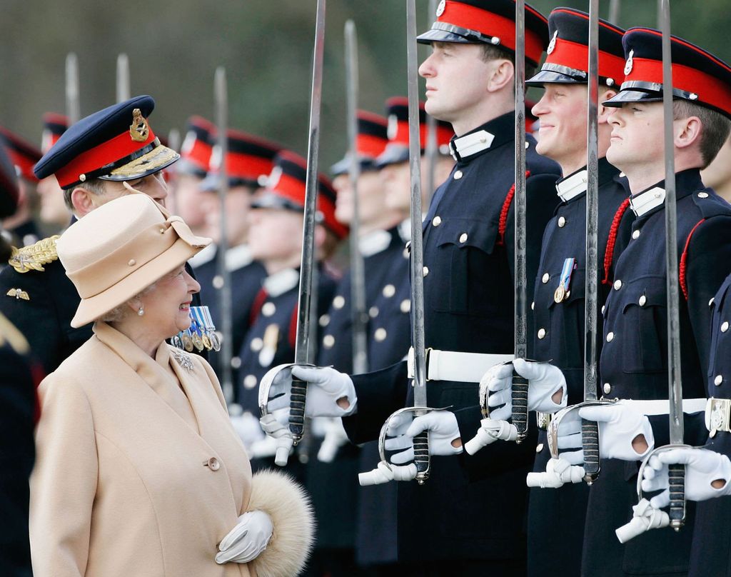 Queen Elizabeth smiles at Prince Harry at passing out parade
