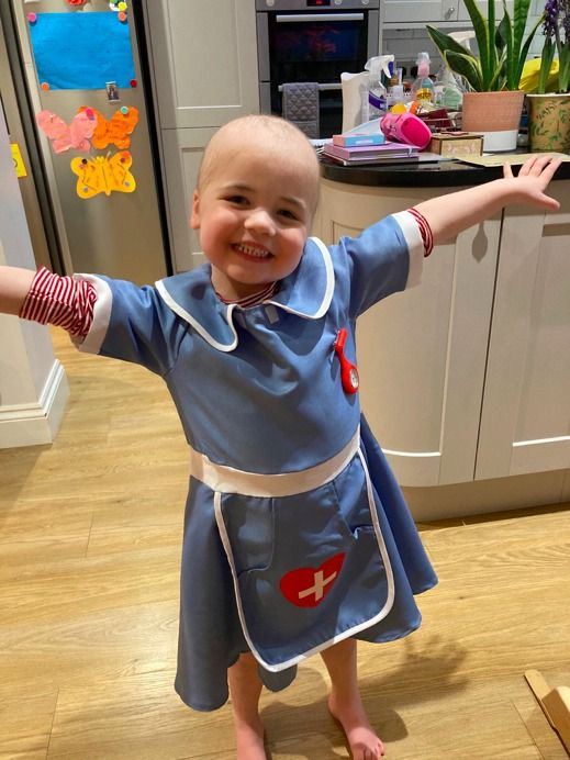 little girl in nurses costume
