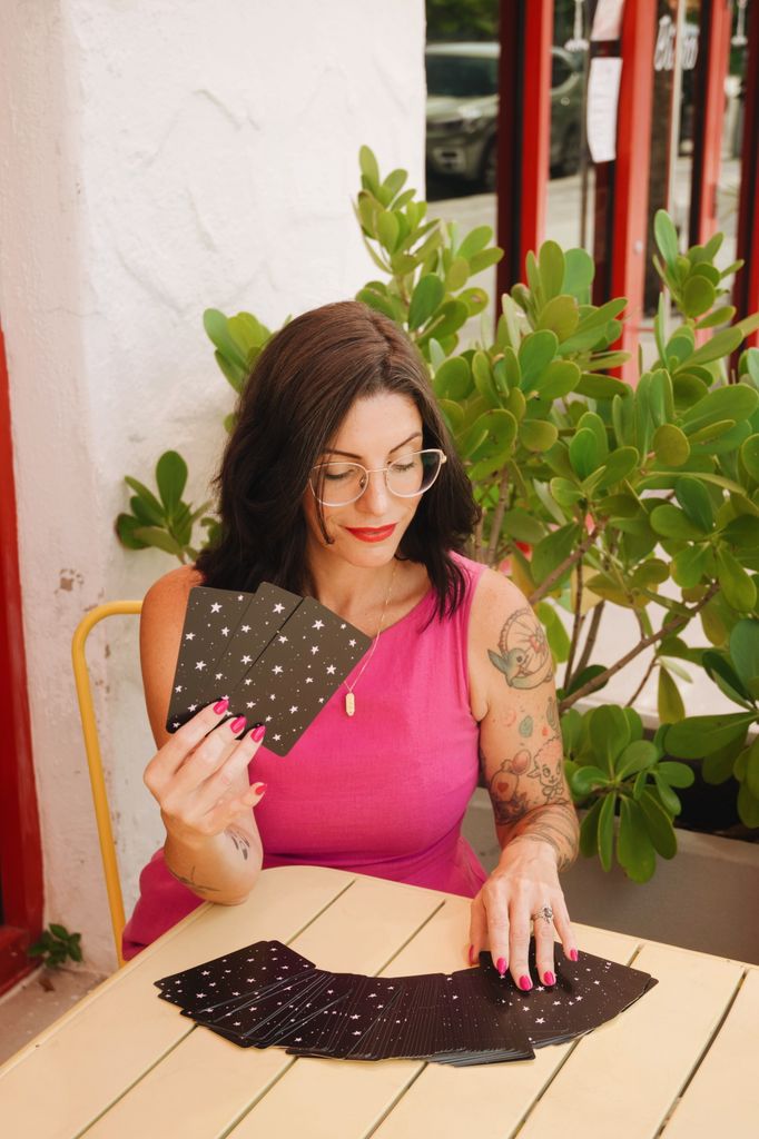 Stefanie with a deck of tarot cards 
