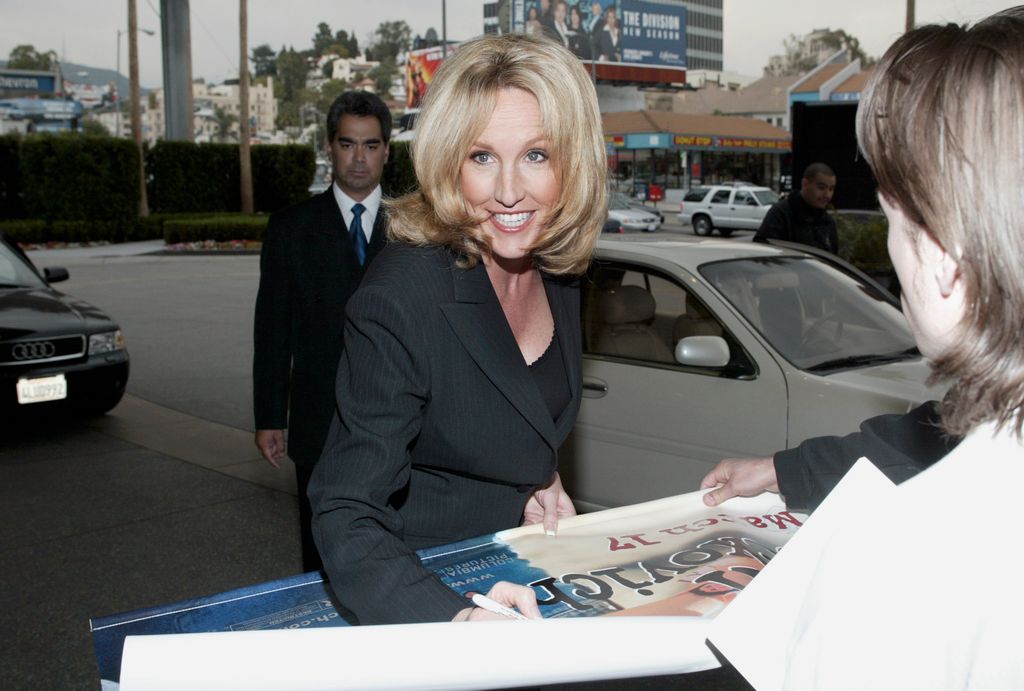 Brockovich signs a movie poster for a fan at the 2003 TCA Press Tour