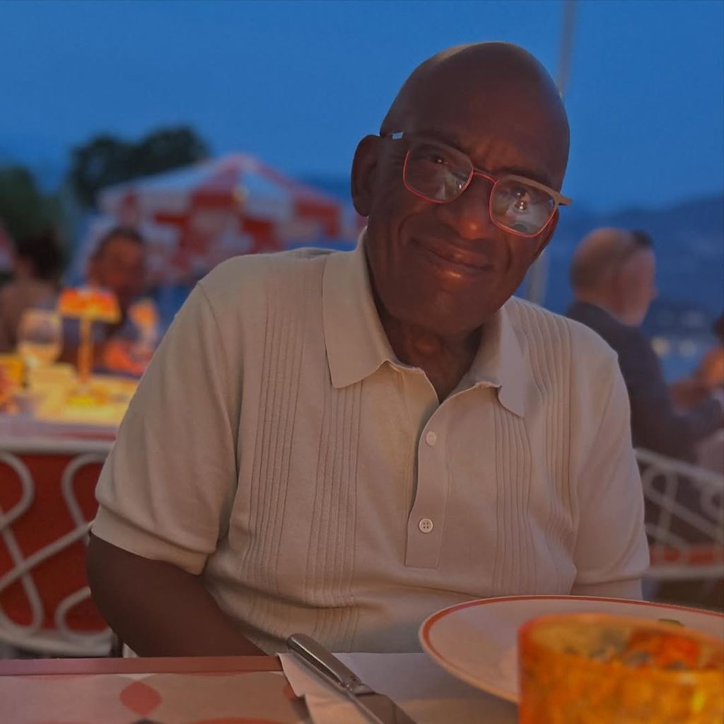 Al Roker poses for a photo during dinner taken by Deborah Roberts on vacation in Italy, shared on Instagram