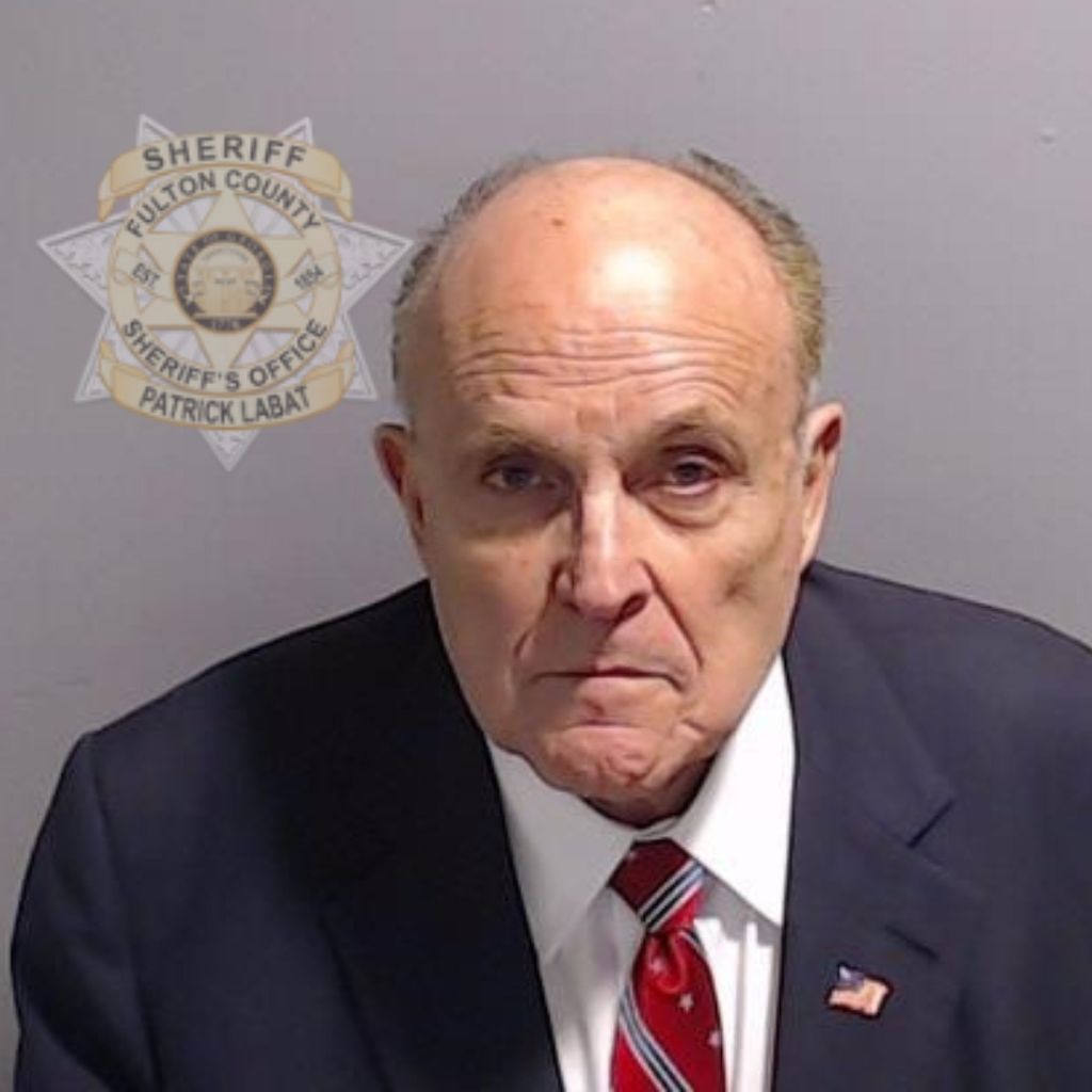 In this handout provided by the Fulton County Sheriff's Office, Rudy Giuliani, former personal lawyer for former President Donald Trump poses for his booking photo on August 23, 2023 in Atlanta, Georgia. Former President Donald Trump and 18 others facing felony charges in the indictment related to tampering with the 2020 election in Georgia have been ordered to turn themselves in by August 25