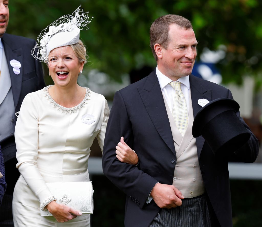 Lindsay Wallace laughs as she wears white and joins Peter Phillips at Royal Ascot
