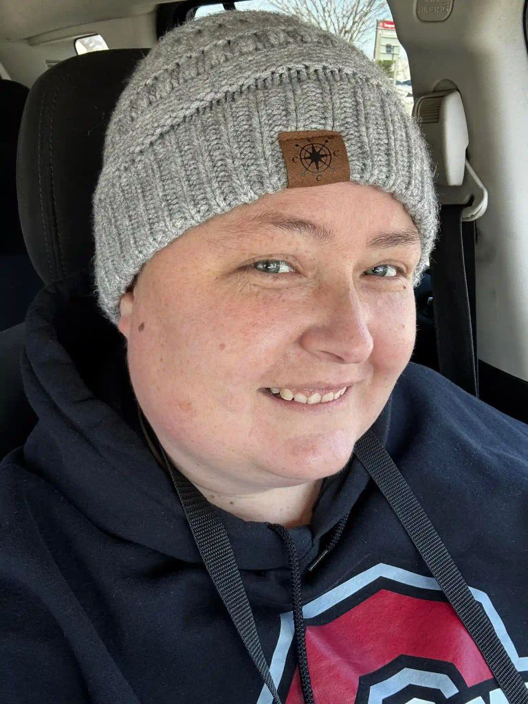 Katie Slaton takers a selfie in her car