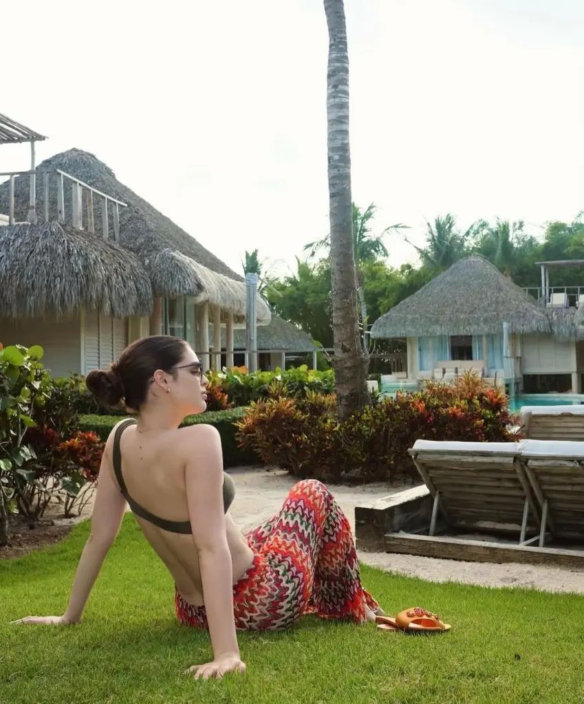 Nadia Ferreira lounges in the gardens at El Oasis in Dominican Republic