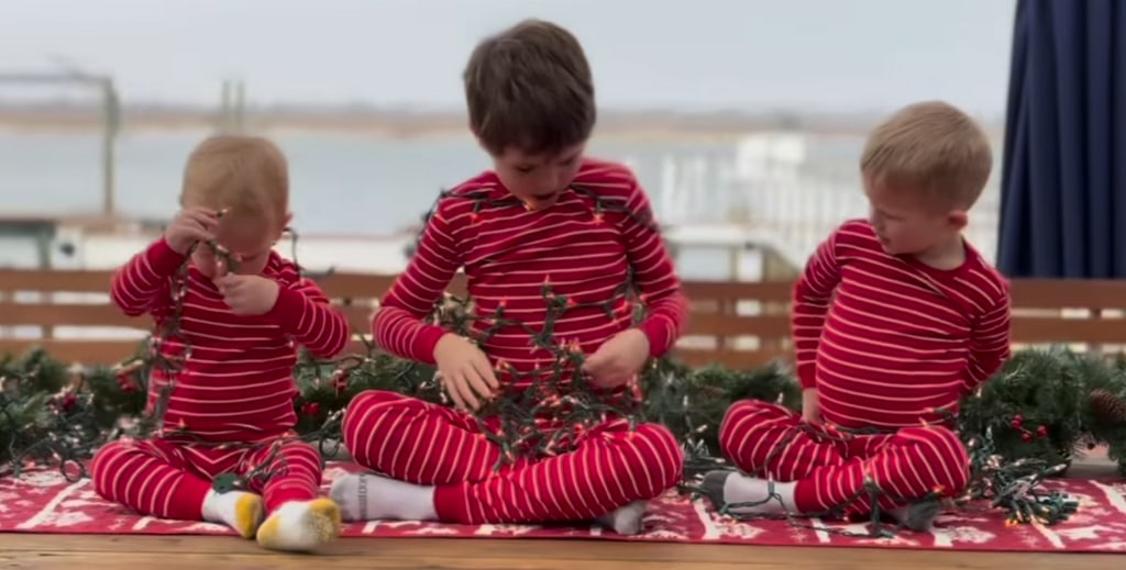 Still from a video shared by Dylan Dreyer on Instagram December 2023 where her three sons are in matching pjs posing for Christmas photos.