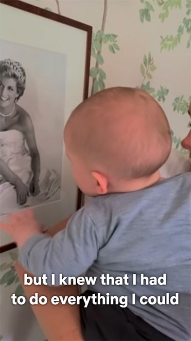 Archie as a baby looking at a framed photo of Princess Diana