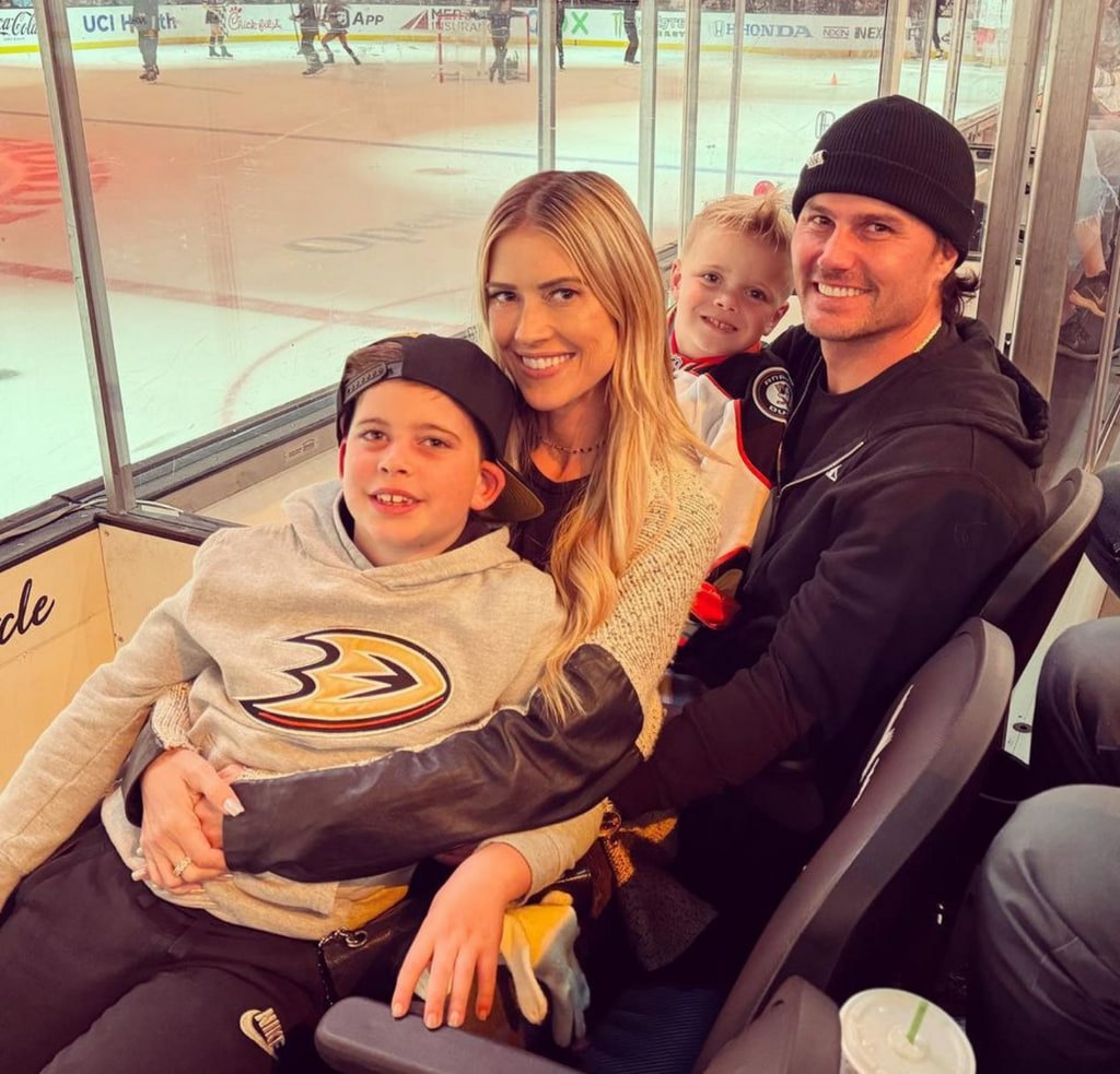 Photo shared by Christina Hall on Instagram November 5 2023 of her with husband Josh Hall with her kids Brayden and Hudson at a hockey game