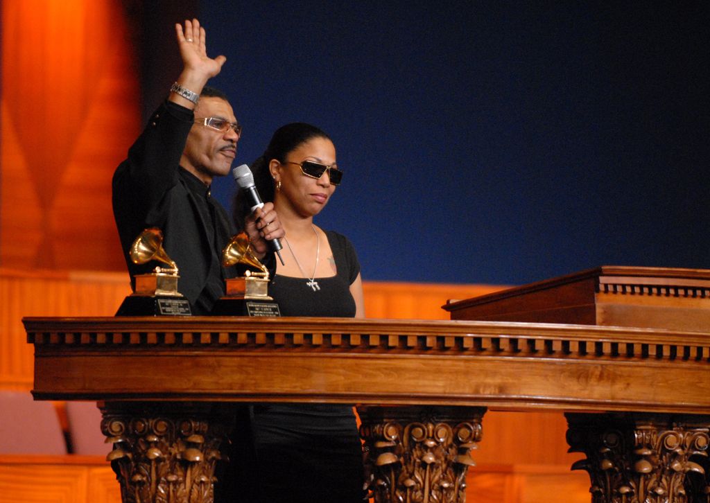 Ike Turner, Jr. and his sister Mia Turner speak with their father's Grammy awards nearby during the memorial service for singer and musician Ike Turner at the City of Refuge Greater Bethany Community Church, in Gardena, 2007