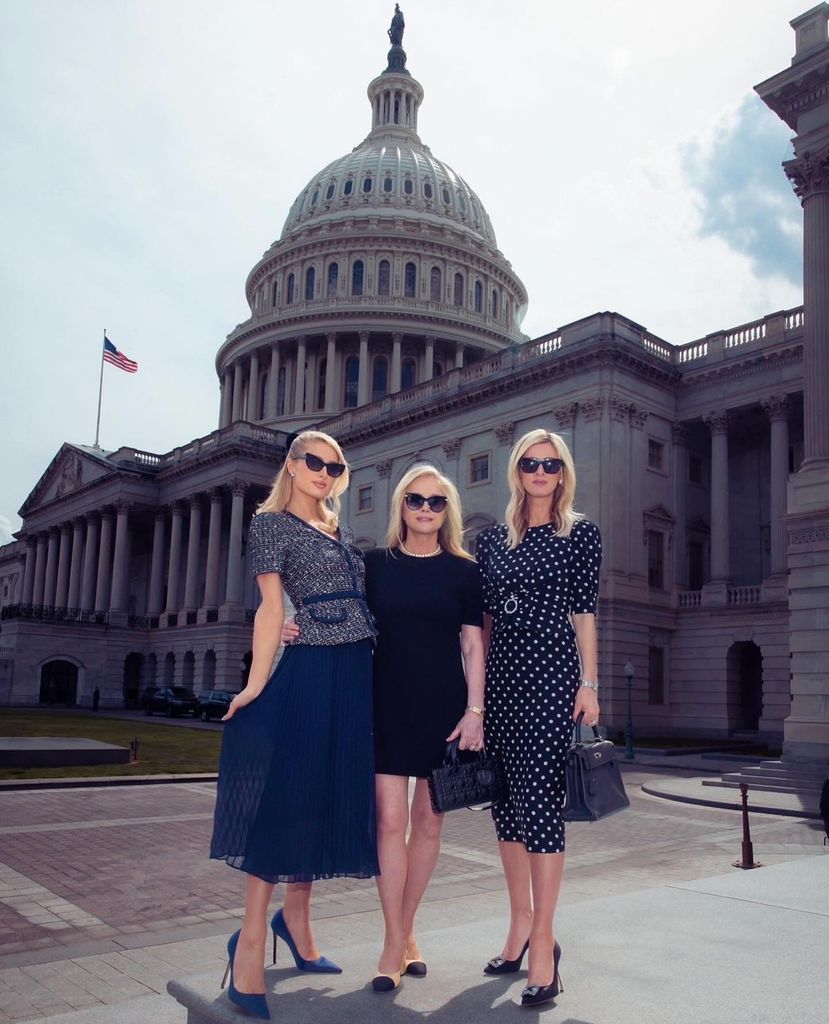 Paris Hilton, Kathy Hilton and Nicky Hilton stand in front of the Congress Building