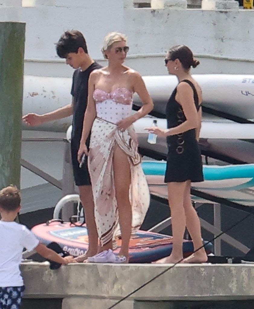 photo of ivanka trump in swimsuit standing on a dock in miami