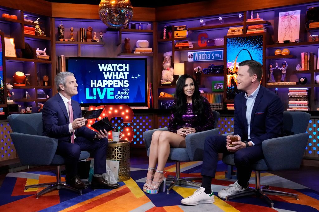 WATCH WHAT HAPPENS LIVE WITH ANDY COHEN -- Episode 20080 -- Pictured: (l-r) Andy Cohen, Rachel Fuda, Willie Geist