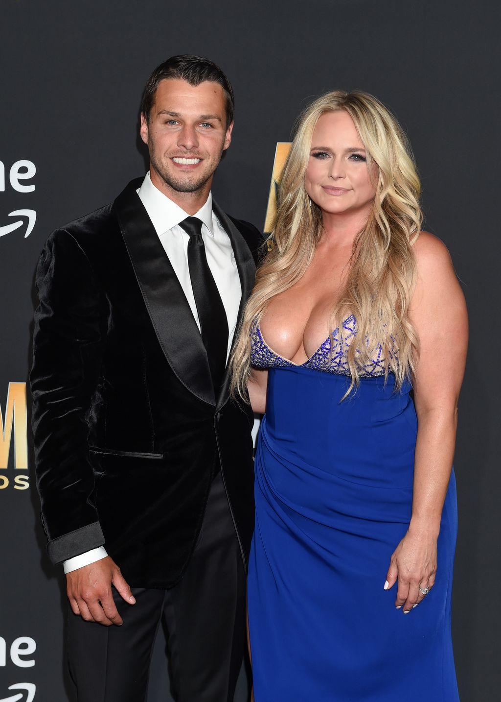 Brendan McLoughlin and Miranda Lambert smiling for a photoshoot together