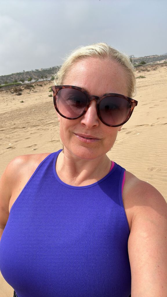 Woman in blue top in the desert 