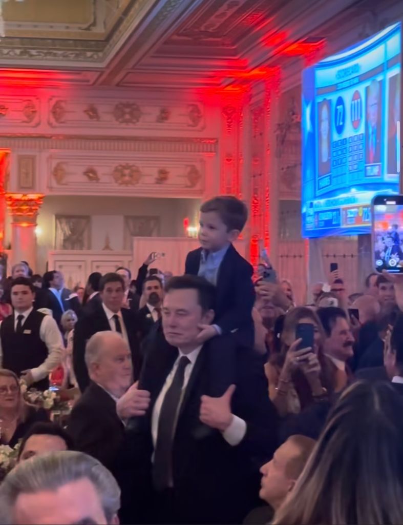 Elon's son sat on his shoulders at the event