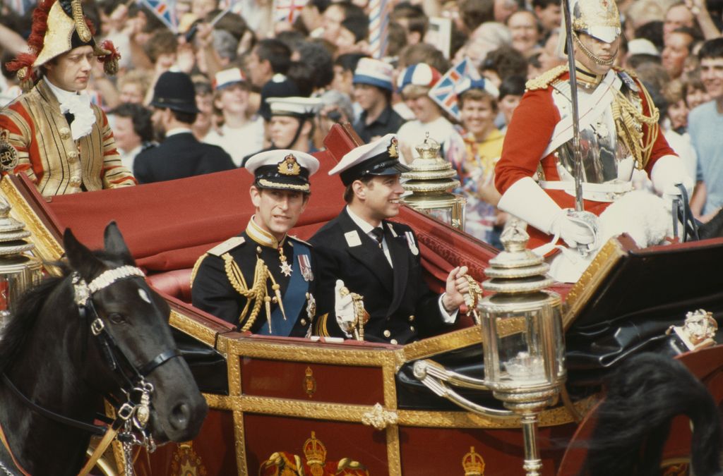 Prince Charles and Prince Andrew in a carriage on their way to the royal wedding in 1981