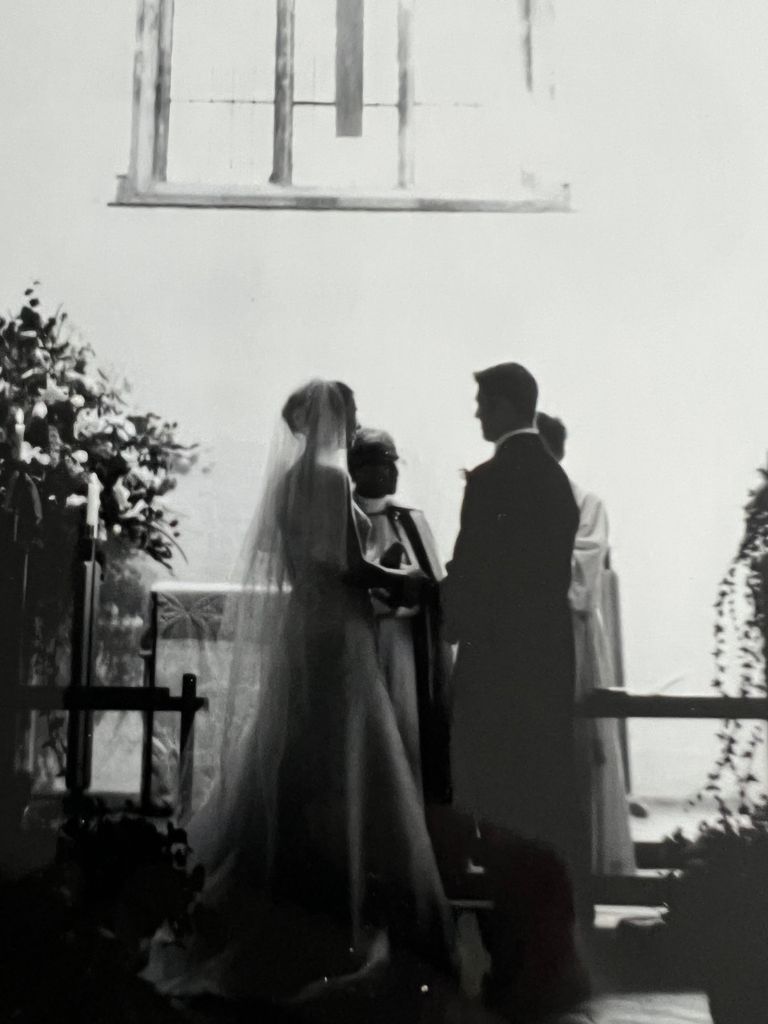 Rosie saying wedding vows with husband black and white photo