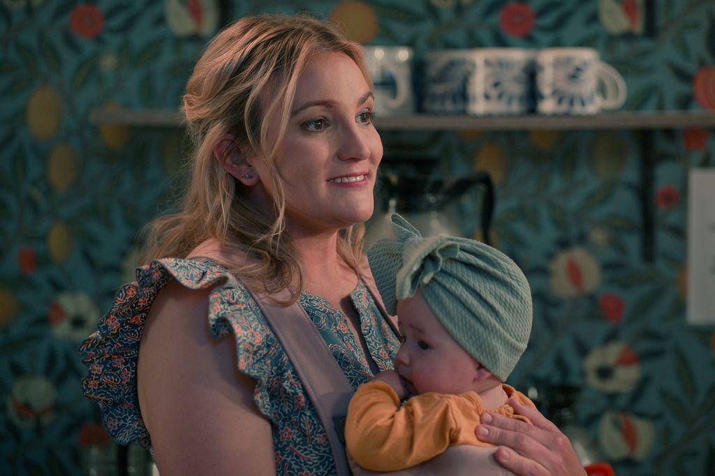 Jamie Lynn Spears as Noreen holds her baby on Sweet Magnolias
