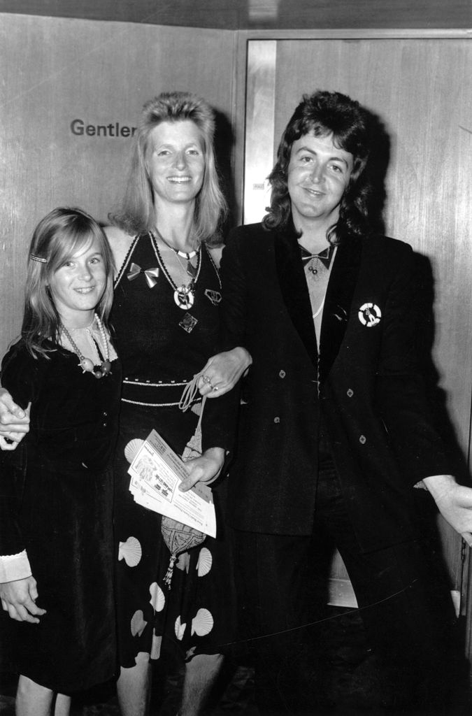 Ex-Beatle Paul McCartney, his wife Linda (1941 - 1998) and her daughter Heather stood together smiling
