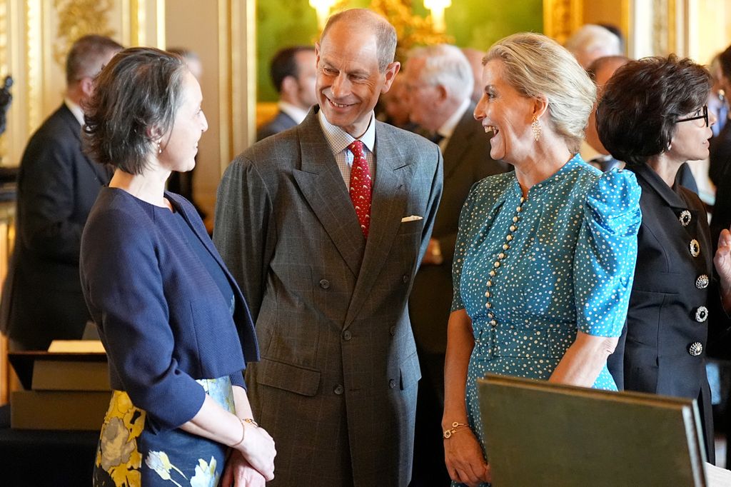 Prince Edwaes and the Duchess of Edinburgh chatting to a woman